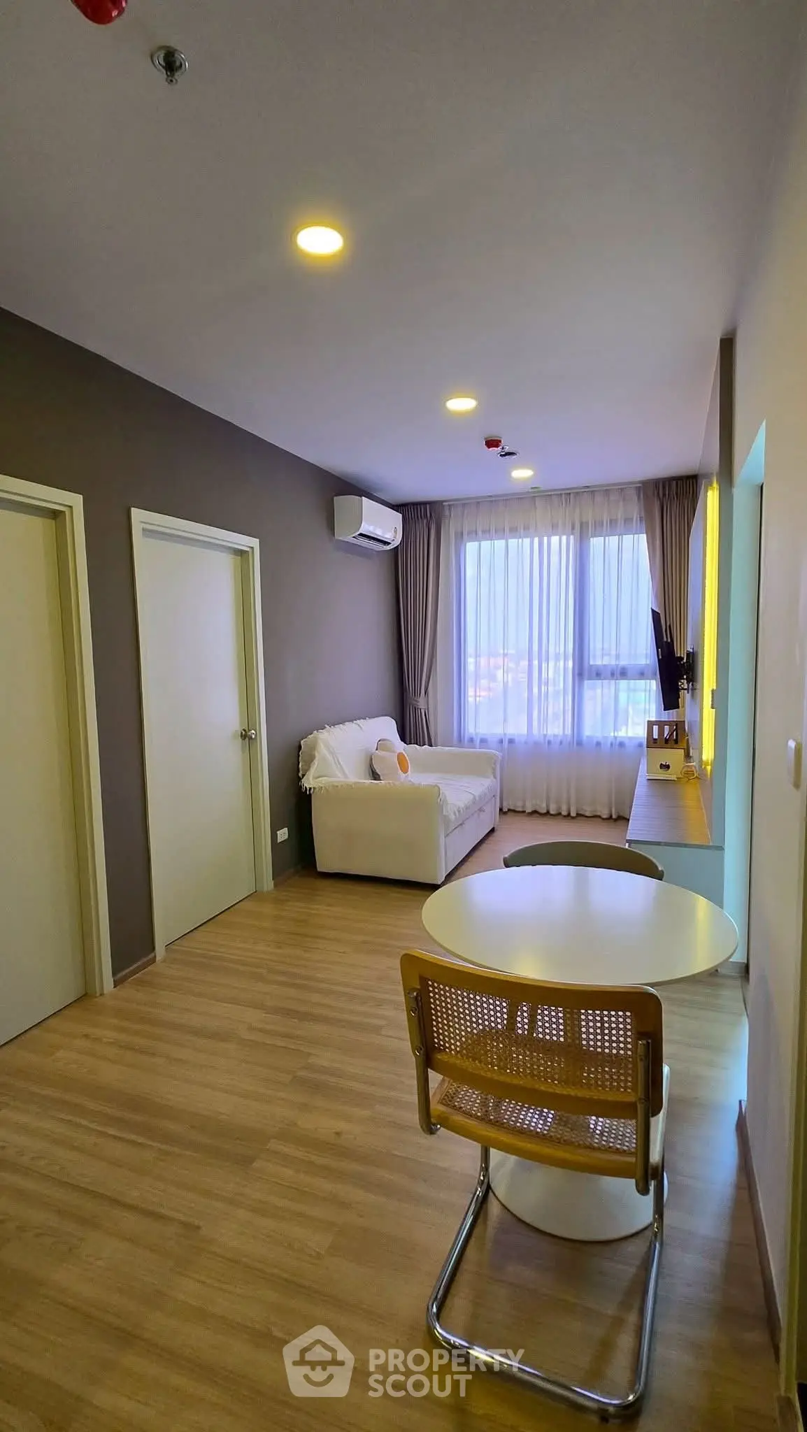 Modern living room with cozy seating and natural light