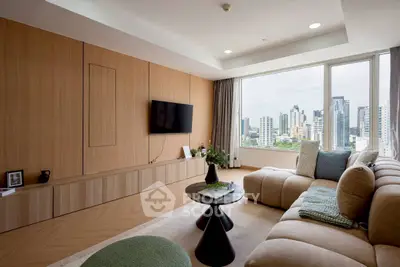 Luxurious living room with panoramic city view, modern furniture, and elegant decor in a high-rise apartment.