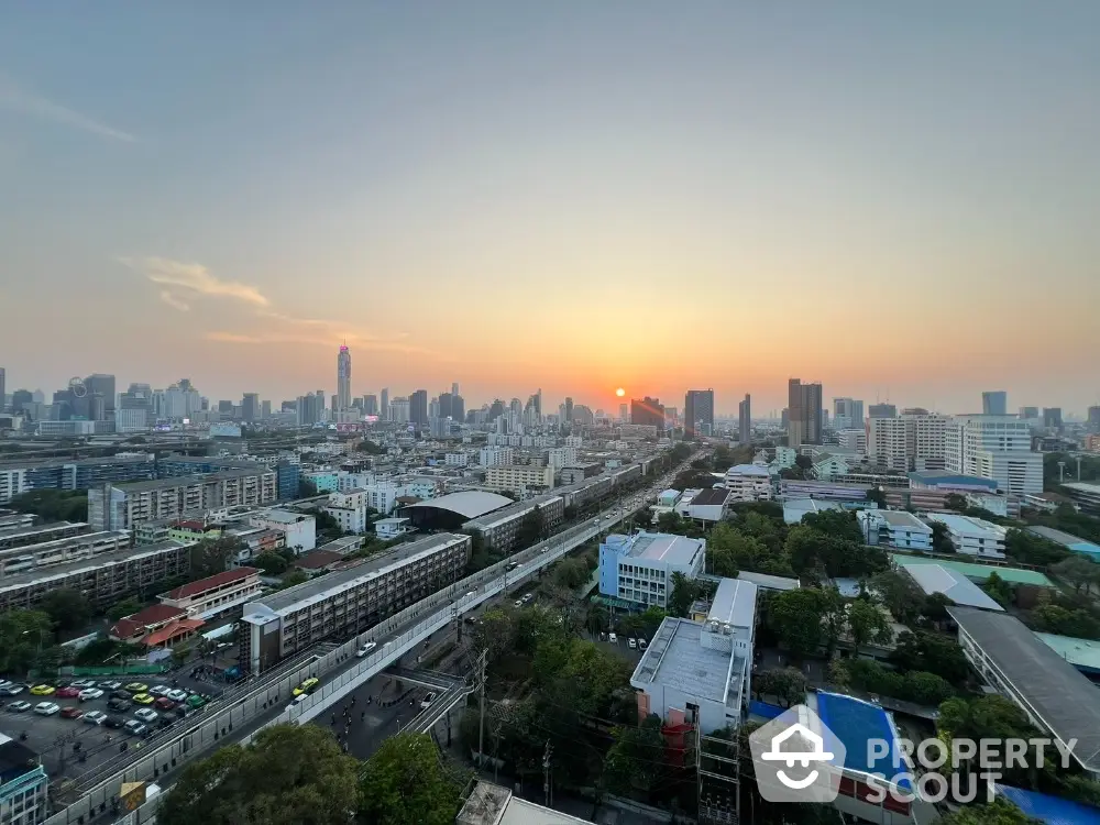 Stunning cityscape view at sunset with skyline and vibrant urban landscape.