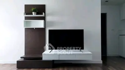 Modern living room with sleek TV stand and minimalist decor