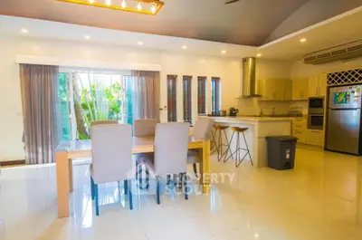 Spacious modern kitchen with dining area and natural light