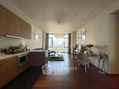 Luxurious open-plan living room with stunning city view and elegant decor.