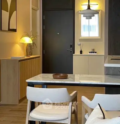 Modern interior with stylish dining area and elegant lighting, perfect for contemporary living.