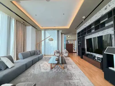 Luxurious modern living room with elegant decor and large windows