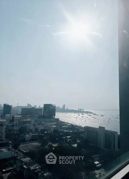 Stunning cityscape view from high-rise building with ocean horizon