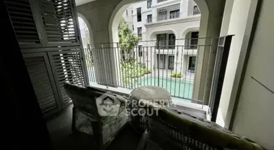 Charming balcony with pool view in luxury residential complex