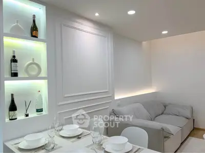 Elegant living room with modern decor and built-in illuminated shelves