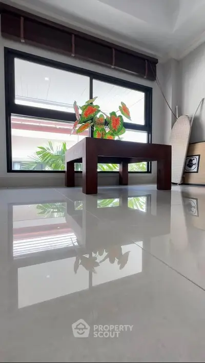Modern interior with sleek table and large window view