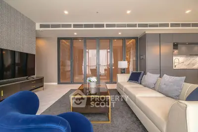 Luxurious modern living room with elegant decor and spacious seating area.