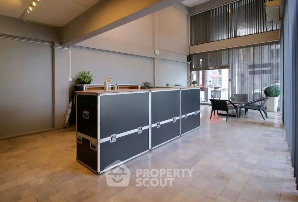 Spacious modern living area with stylish decor and large windows