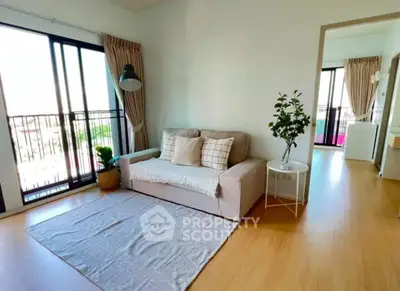 Bright and cozy living room with modern decor and large windows