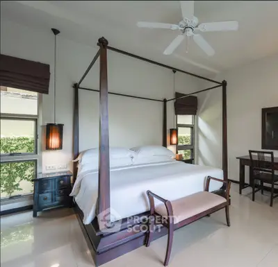 Luxurious bedroom with elegant four-poster bed and stylish decor