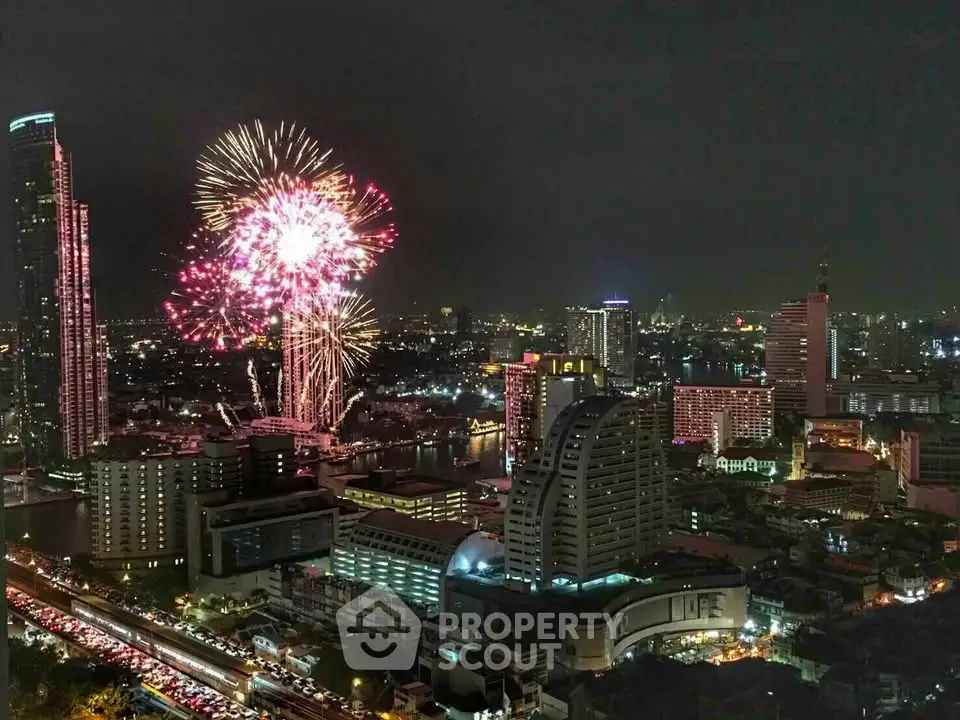 Stunning cityscape with vibrant fireworks illuminating the night sky, showcasing urban living at its finest.
