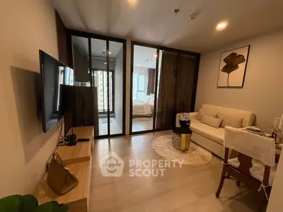 Modern living room with glass partition and cozy decor