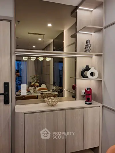 Stylish modern interior with elegant decor and built-in shelving in a cozy living space.