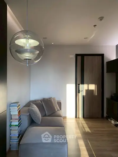 Modern living room with sleek design and cozy seating area