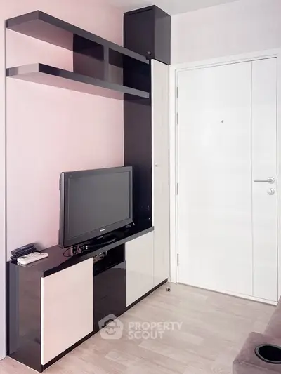 Modern living room with sleek TV unit and stylish shelving