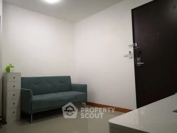 Modern minimalist living room with sleek sofa and storage unit