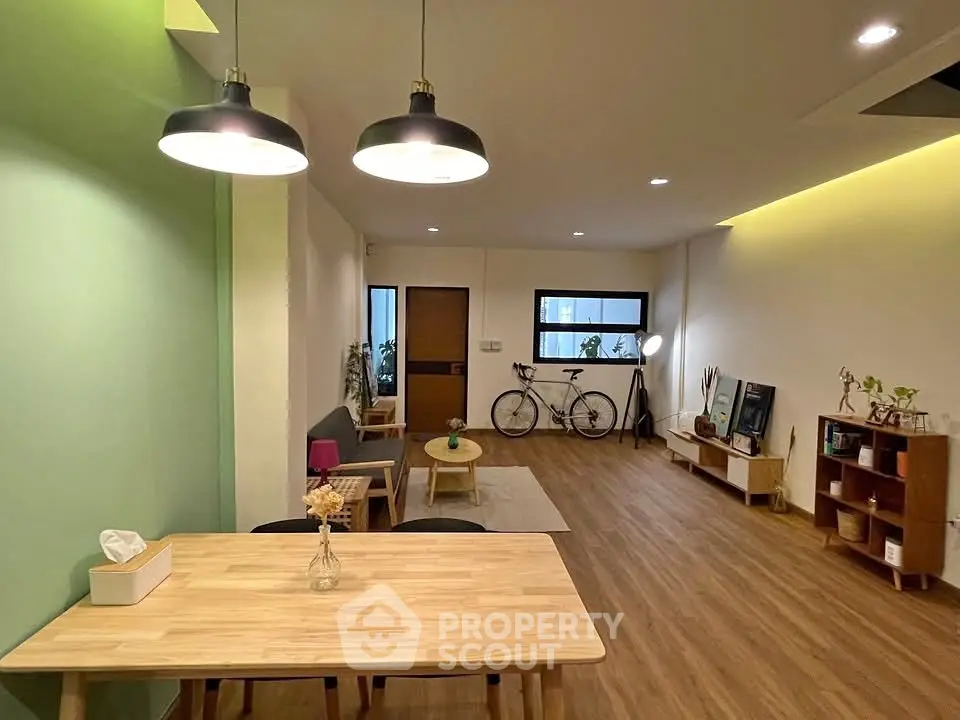 Spacious modern living room with wooden flooring and stylish decor