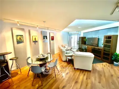 Spacious modern living room with stylish decor and wooden flooring