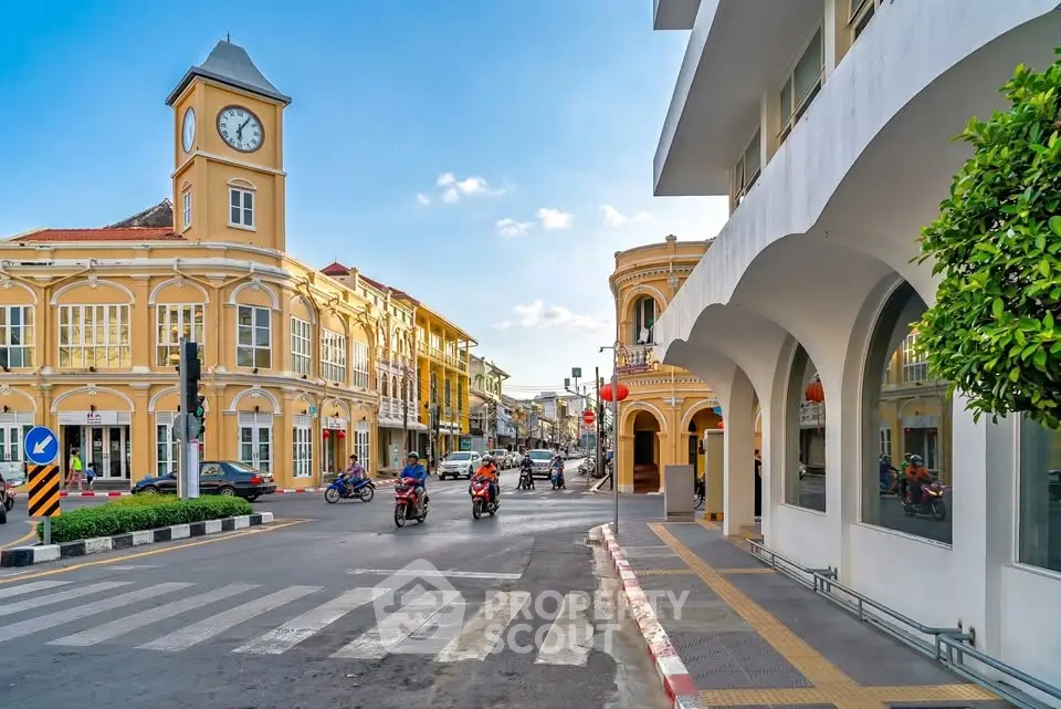 Charming street view with colonial architecture and vibrant city life.