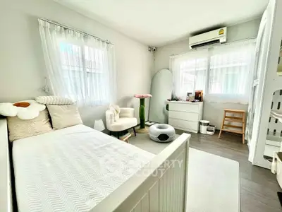 Bright and cozy bedroom with modern decor and natural light