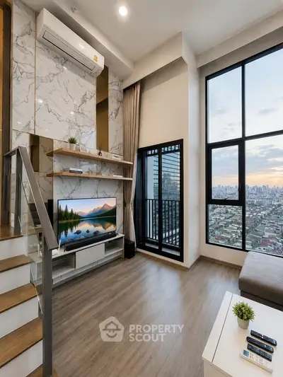 Modern living room with large windows and city view, featuring stylish decor and a cozy atmosphere.