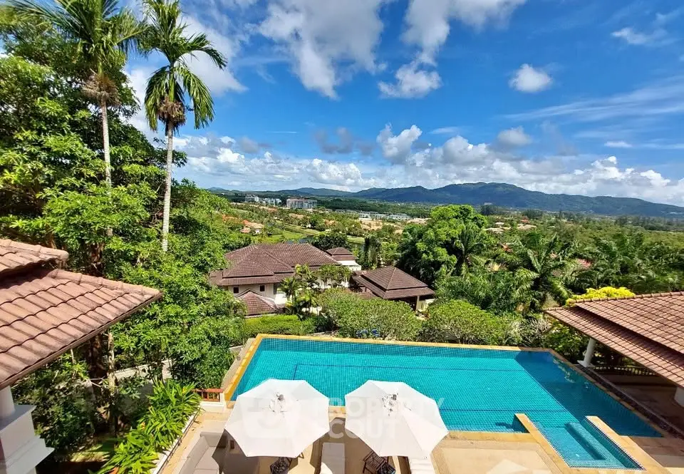 Stunning villa with pool and panoramic mountain views in tropical paradise setting.