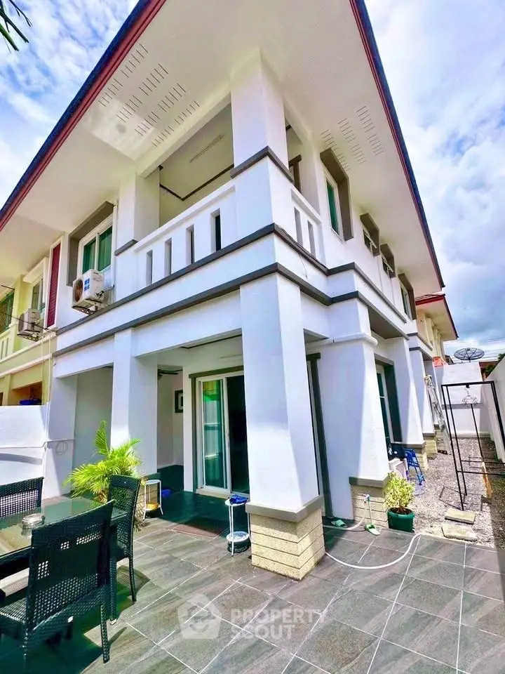 Modern two-story house with spacious patio and sleek design