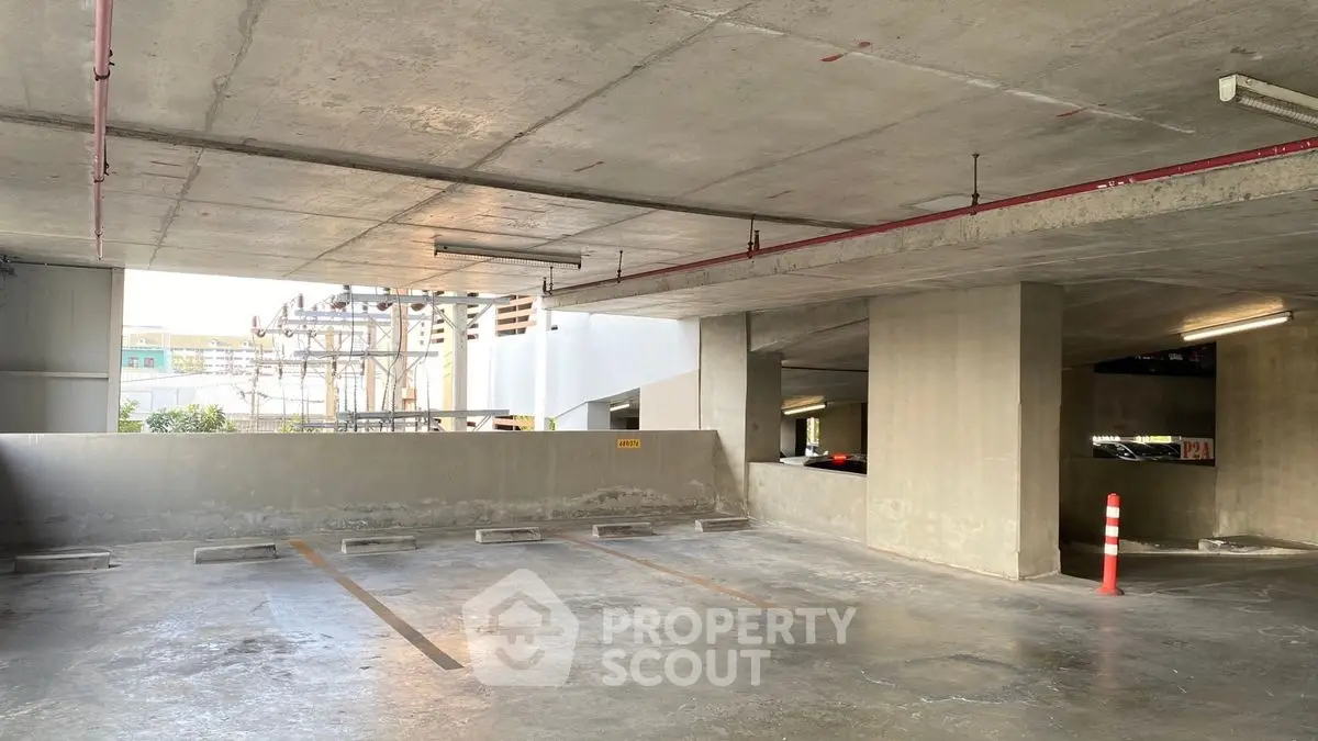 Spacious urban parking garage with ample lighting and open spaces.