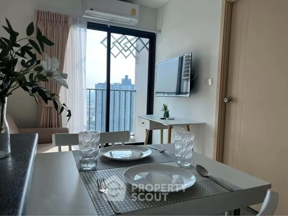 Modern apartment dining area with balcony view and stylish decor