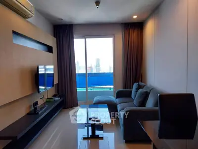 Modern living room with city view and sleek furniture