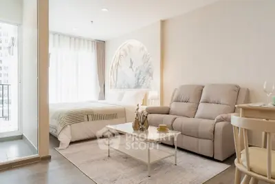 Modern studio apartment with cozy living area and stylish decor