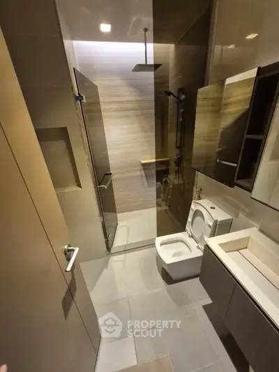 Modern bathroom with sleek fixtures and glass shower enclosure