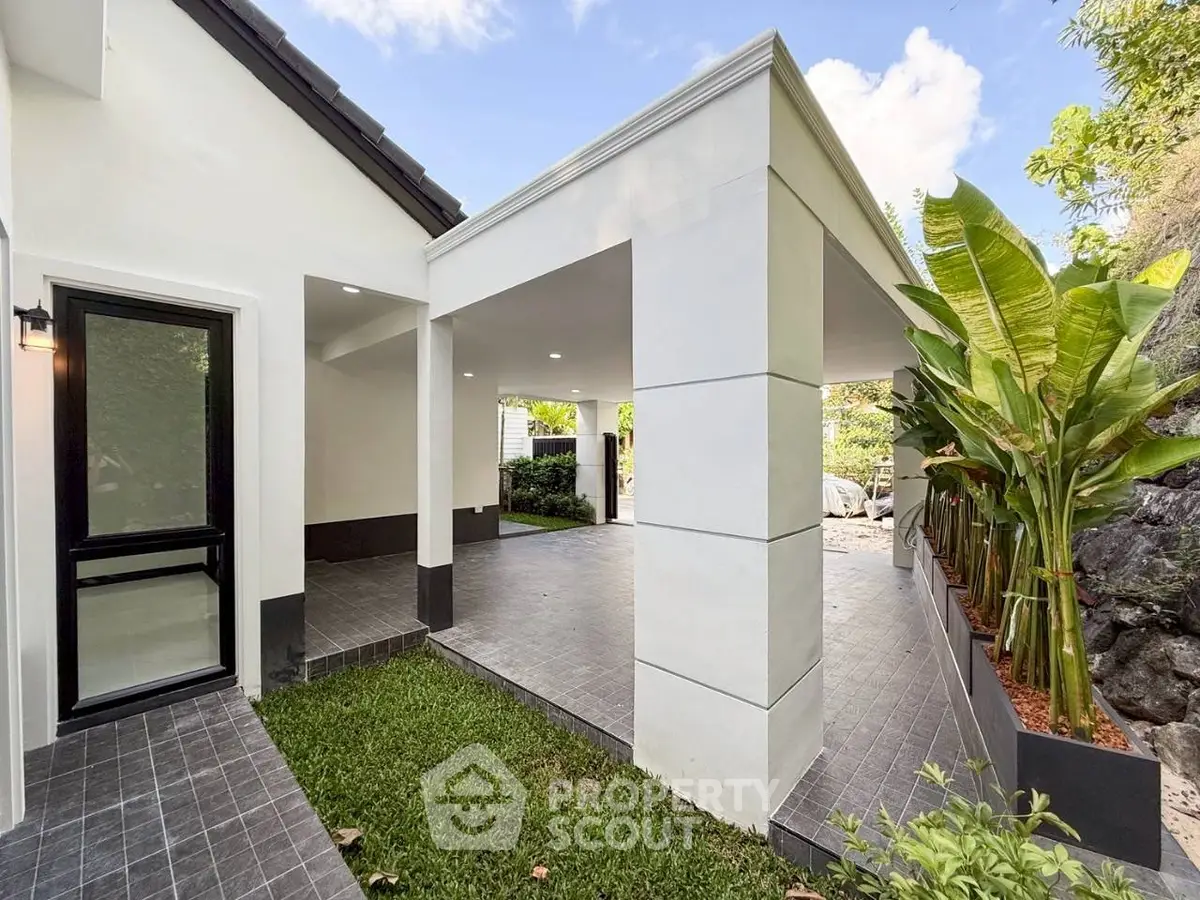 Modern exterior with sleek design and lush greenery, perfect for contemporary living.