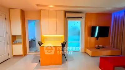 Modern living room with sleek design, featuring a wall-mounted TV and stylish dining area.