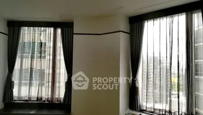 Spacious corner unit with large windows offering city views, perfect for natural light lovers.
