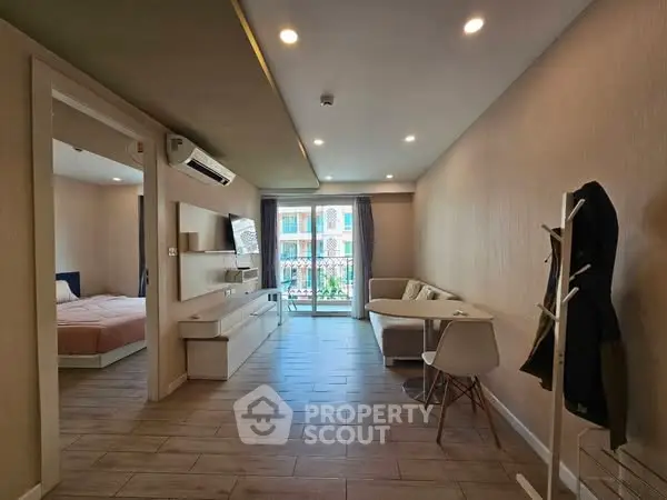 Spacious modern living room with open layout and balcony view