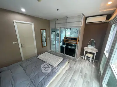 Modern bedroom with large mirror, air conditioning, and stylish decor