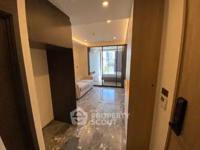 Modern apartment interior with marble flooring and balcony view