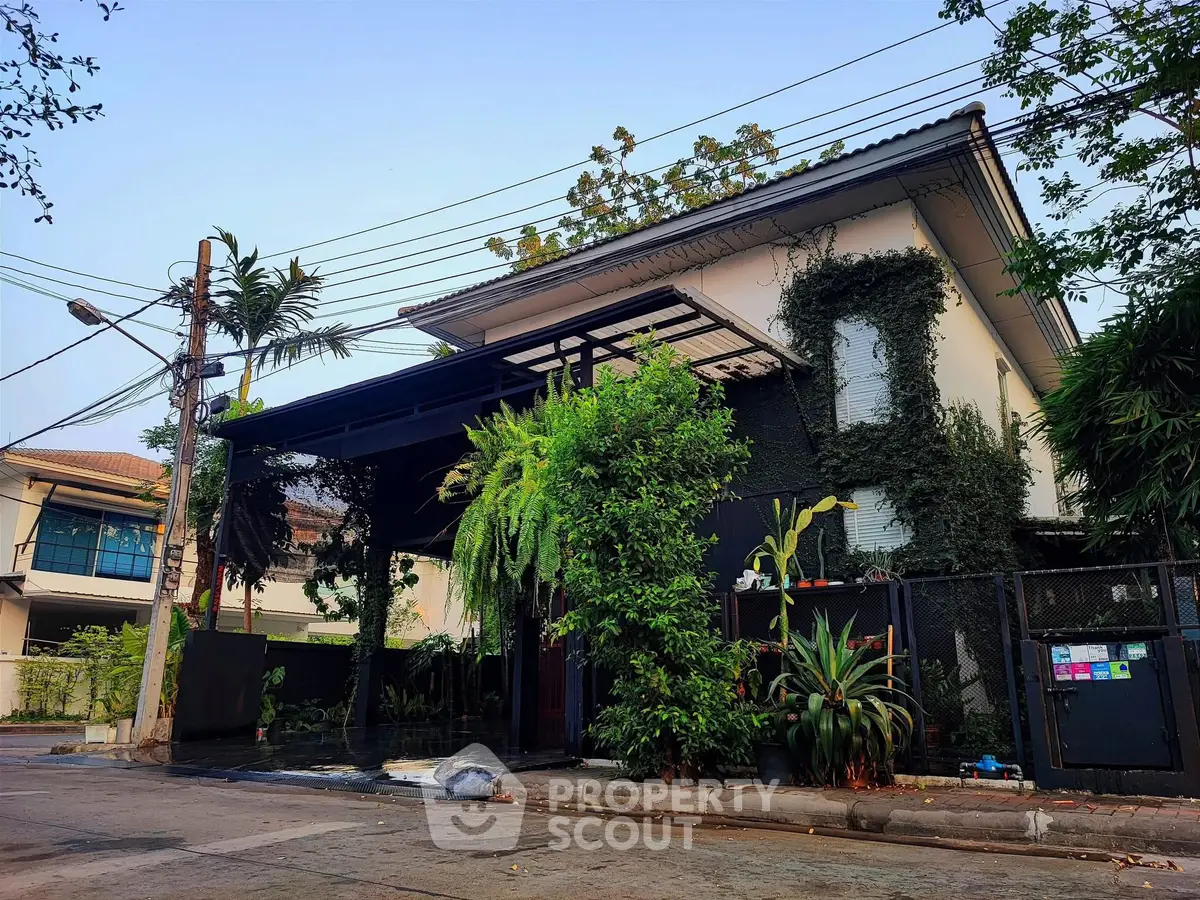 Charming modern house with lush greenery and stylish exterior design.