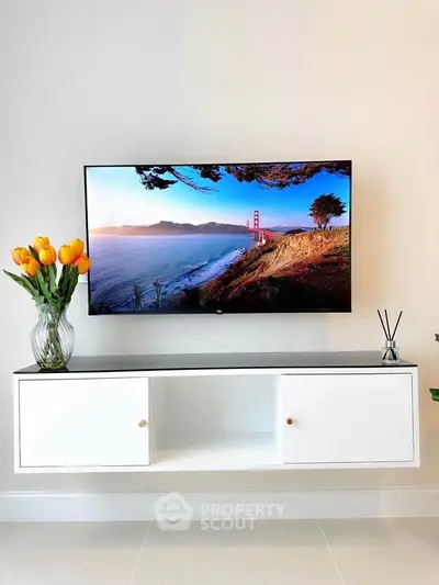 Modern living room with wall-mounted TV and elegant decor