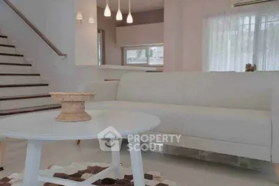 Elegant modern living room with white sofa and stylish decor