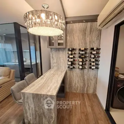 Luxurious home bar with elegant chandelier and wine rack