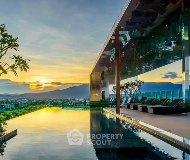 Luxurious rooftop infinity pool with stunning sunset view and modern architecture.