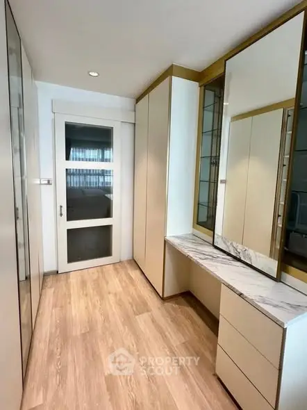Spacious walk-in closet with modern design and ample storage space