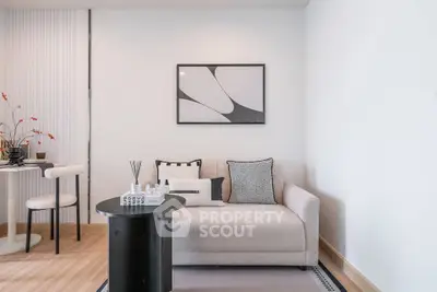 Modern living room with stylish decor and cozy seating area, perfect for relaxation and entertaining.
