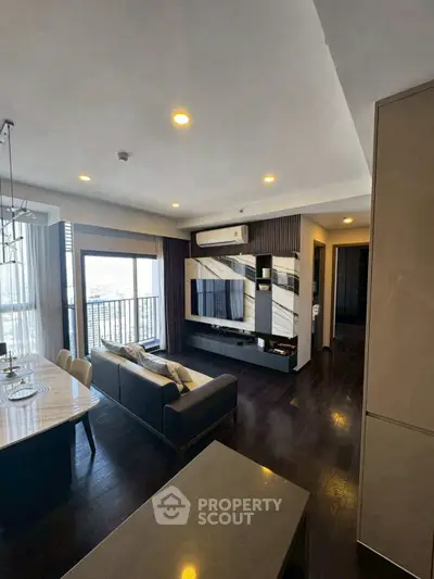 Modern living room with sleek design, open layout, and balcony view in luxury apartment.