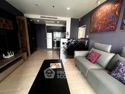 Modern living room with stylish decor and open kitchen layout