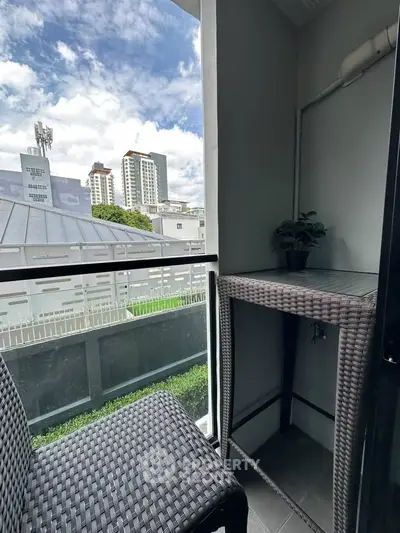 Charming balcony with city view, perfect for relaxation and enjoying the outdoors.